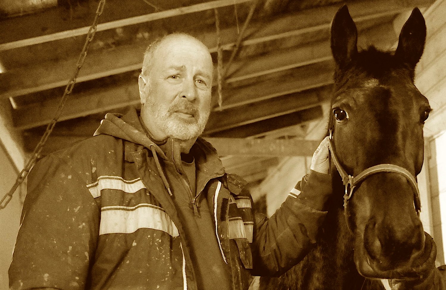 Bob Lounsbury in his stables at Monticello Raceway.